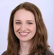 Woman with brown hair smiling