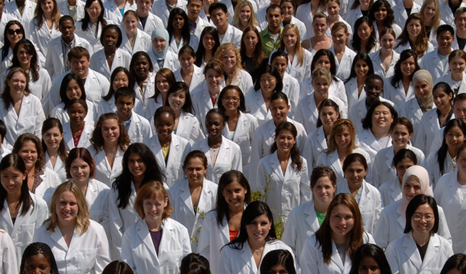 Pharmacy Students in white coats.